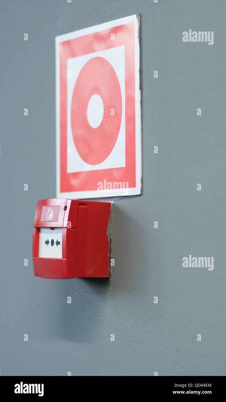 Sign building extinguisher emergency corridor fire red rescue alarm danger, from wall box for warning for background safe, service school. Crisis Stock Photo