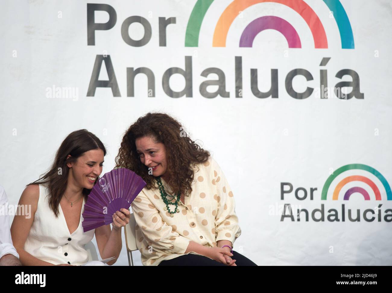 Spain's Minister of Equality Irene Montero (L) is seen laughing with Andalusian candidate to led the Andalusian government Inma Nieto (R) in a rally during the closing of Andalusian electoral campaign. Following the announcement of regional elections to be held on the 19th of June, the main political parties have started holding events and rallies in different cities in Andalusia. Several media polls place the Andalusian Popular Party in the lead, despite the rise of the Spanish far-right party VOX. Parties on the left of the political spectrum are fragmented. (Photo by Jesus Merida/SOPA Im Stock Photo
