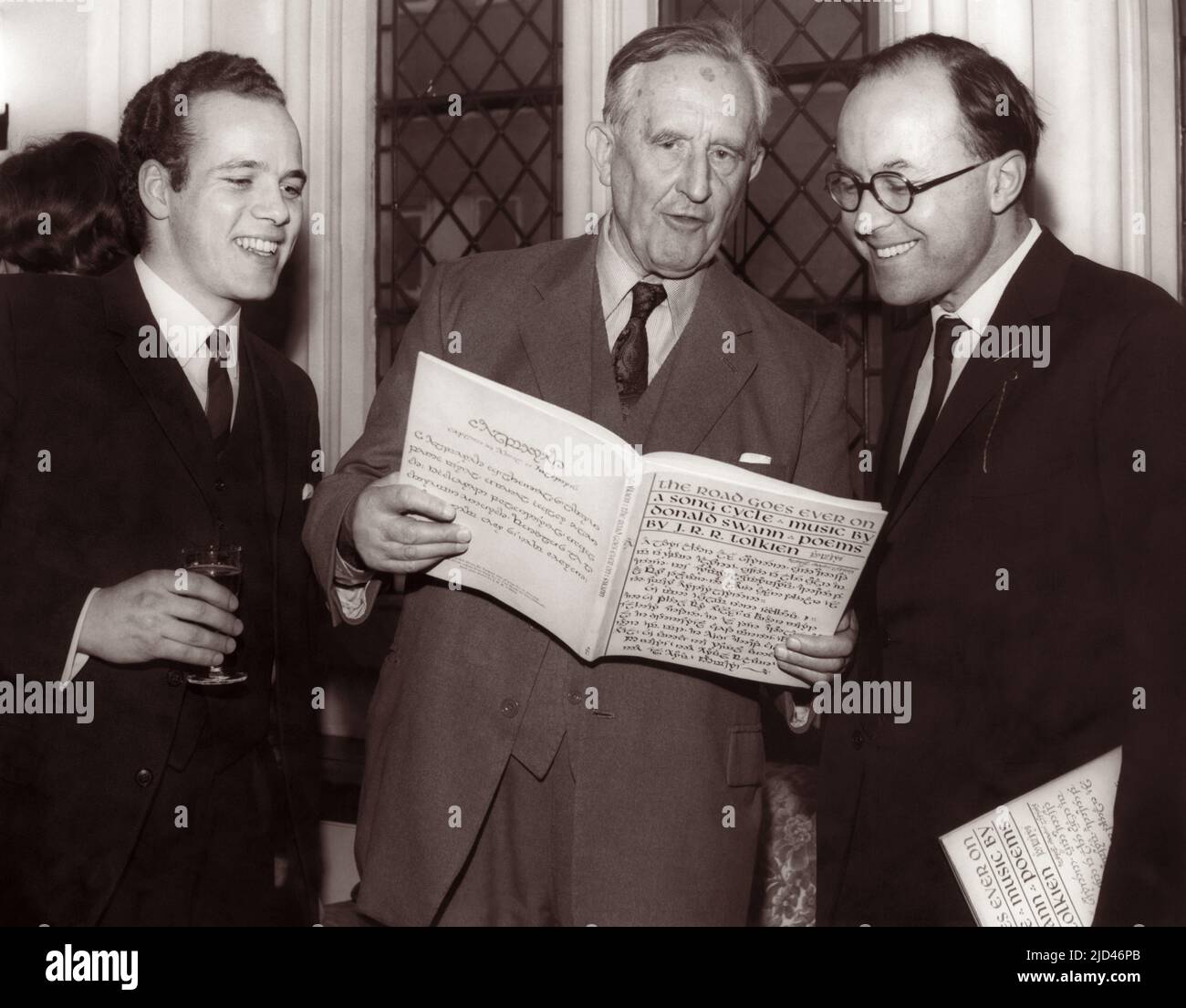 J.R.R. Tolkien (center), British author of The Hobbit and The Lord of the Rings, at the UK launch on March 14, 1968 at Crosby Hall in Chelsea of the book The Road Goes Ever On: a Song Cycle, written by Tolkien with music by Donald Swann (right). An LP record of this song cycle was recorded earlier on June 12, 1967 as Poems and Songs of Middle Earth, with Donald Swann on piano and William Elvin (left) singing. The album also included Tolkien himself reading six poems from The Adventures of Tom Bombadil. Stock Photo