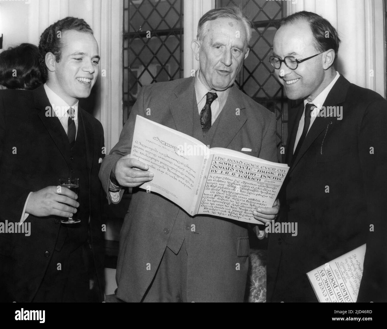 J.R.R. Tolkien (center), British author of The Hobbit and The Lord of the Rings, at the UK launch on March 14, 1968 at Crosby Hall in Chelsea of the book The Road Goes Ever On: a Song Cycle, written by Tolkien with music by Donald Swann (right). An LP record of this song cycle was recorded earlier on June 12, 1967 as Poems and Songs of Middle Earth, with Donald Swann on piano and William Elvin (left) singing. The album also included Tolkien himself reading six poems from The Adventures of Tom Bombadil. Stock Photo