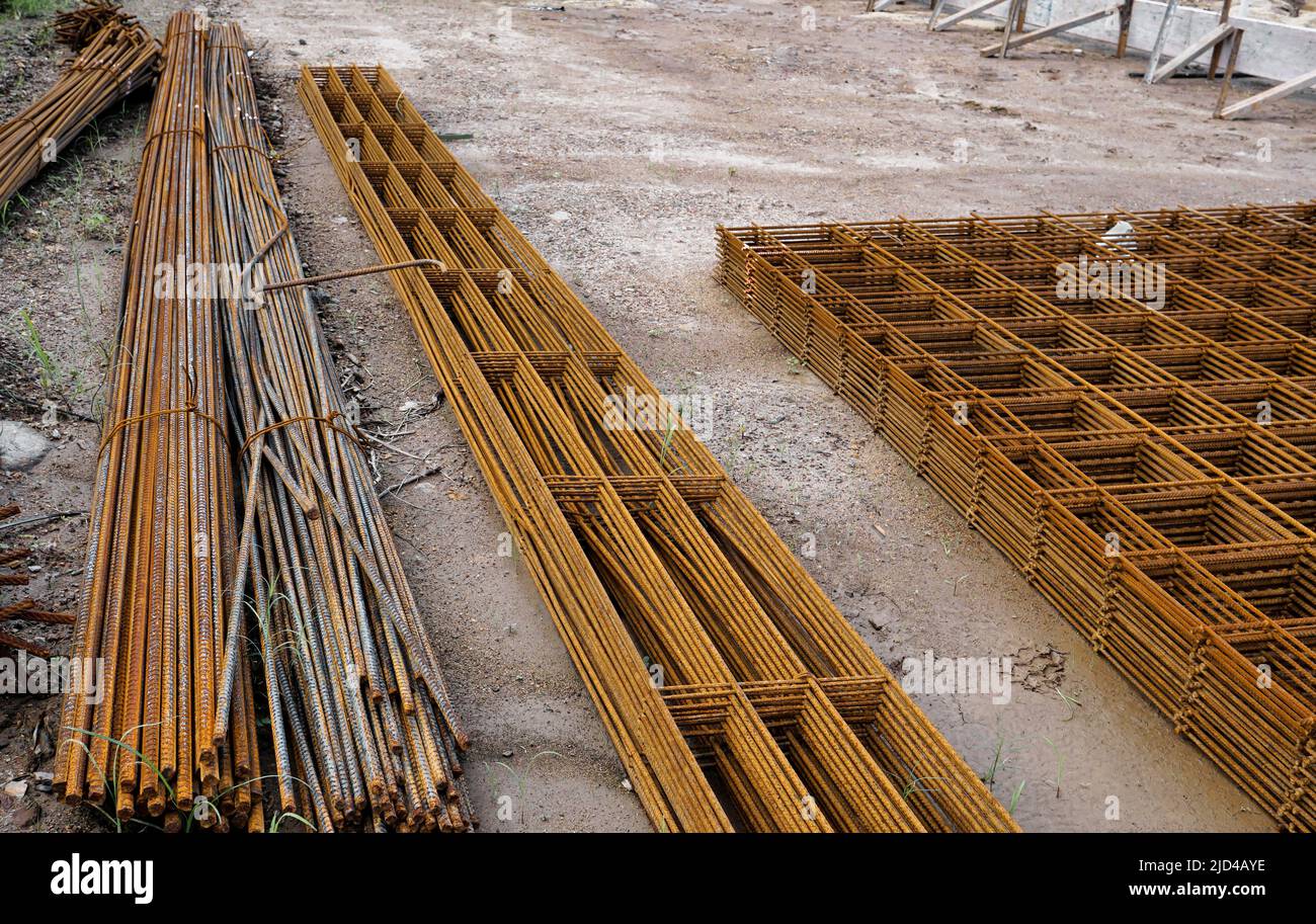 Stacked rusty steel wire mesh for slab concrete work at the construction site Stock Photo