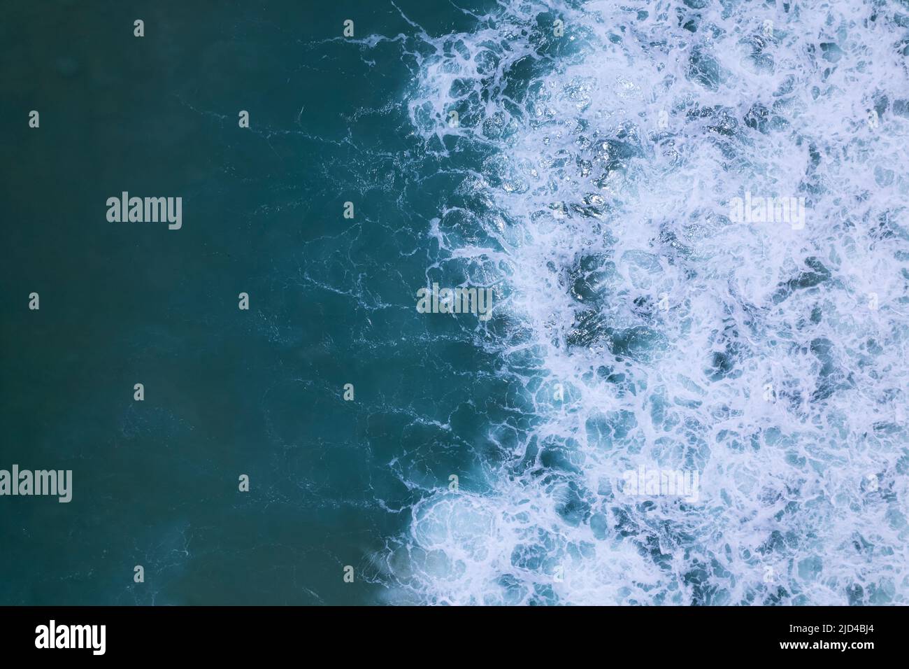 Sea blue surface aerial view.Top view blue water ocean waves with white ...