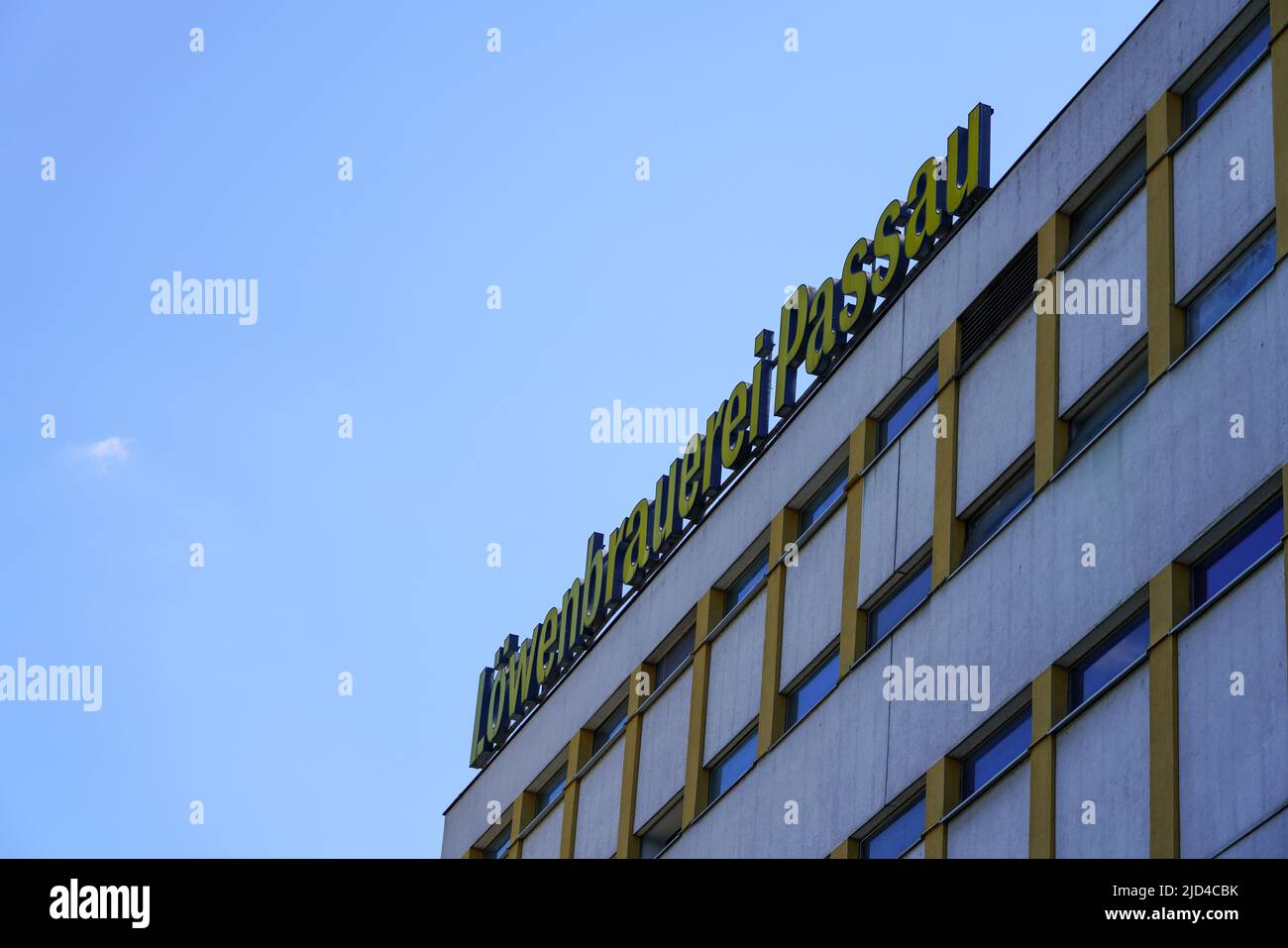 Large name roof sign of the Löwenbrauerei, a German beer brewery located in Passau, Bavaria, Germany, 11.6.22 Stock Photo