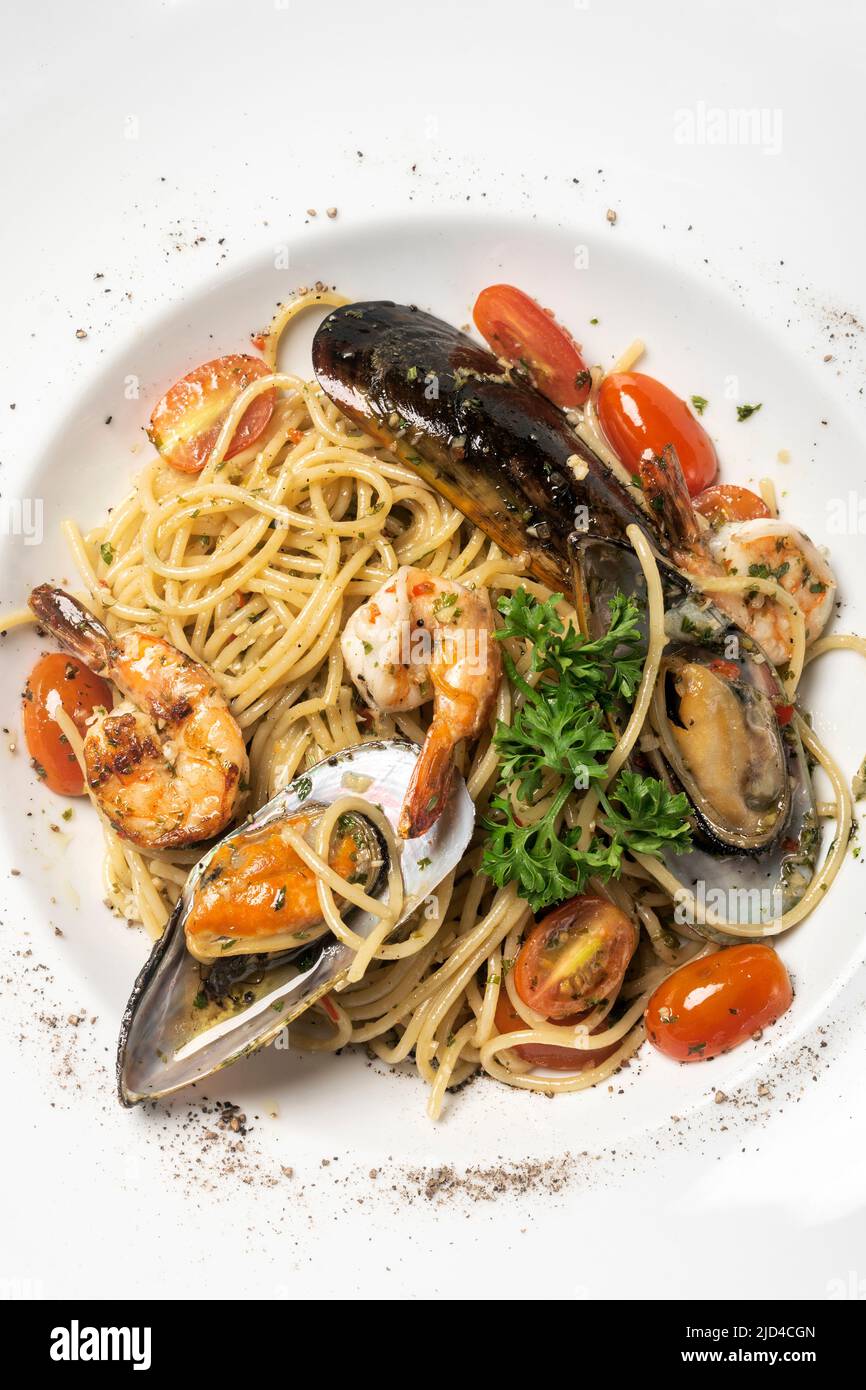 frutti di mare fresh mixed seafood spaghetti on white background Stock Photo