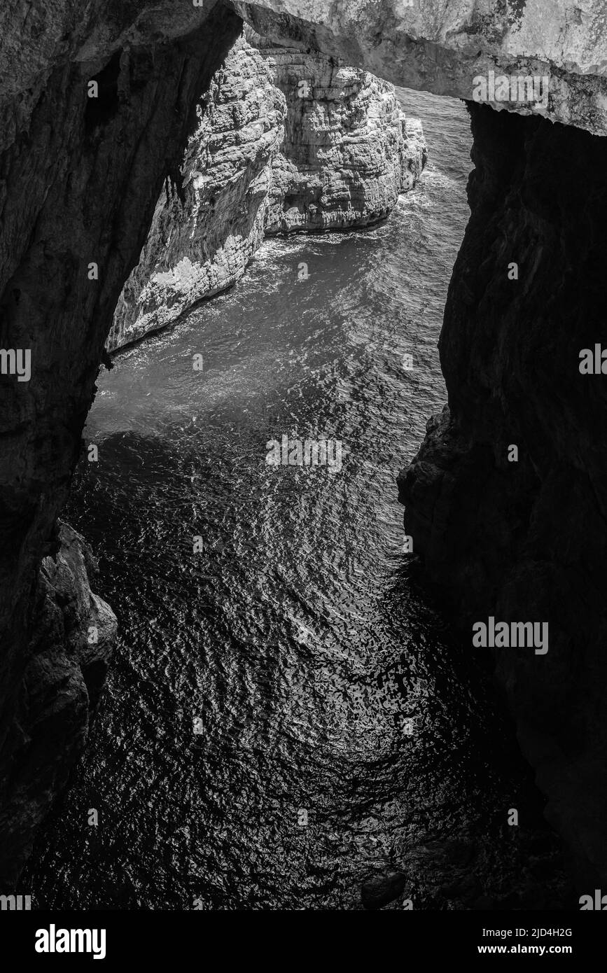 Grotta del Turco is so called, as in the ninth century the ships of the Saracens took refuge in the crevices of this strategic promontory Stock Photo