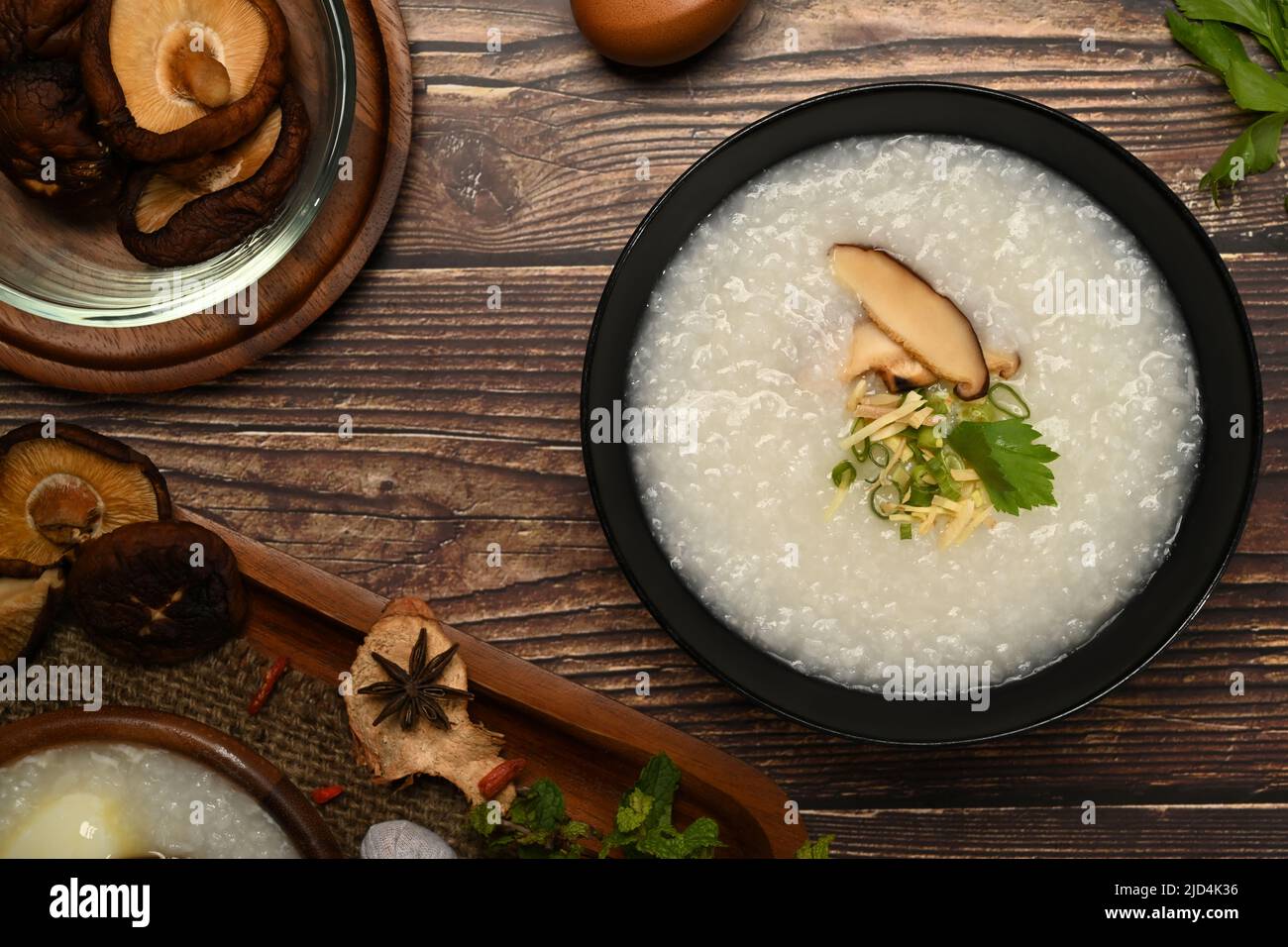 Rice porridge with shiitake mushroom, slice ginger and scallion. Congee