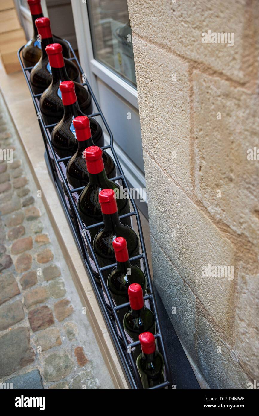 All classic French wine bottle size in front of a winery Stock Photo Alamy
