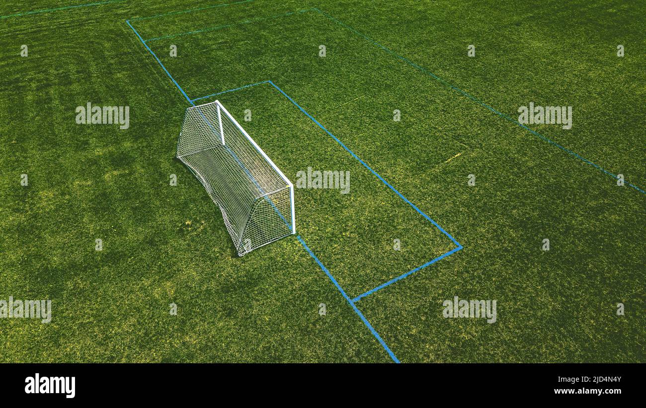 Fresh green grass is growing on the soccer fields at a local park Stock