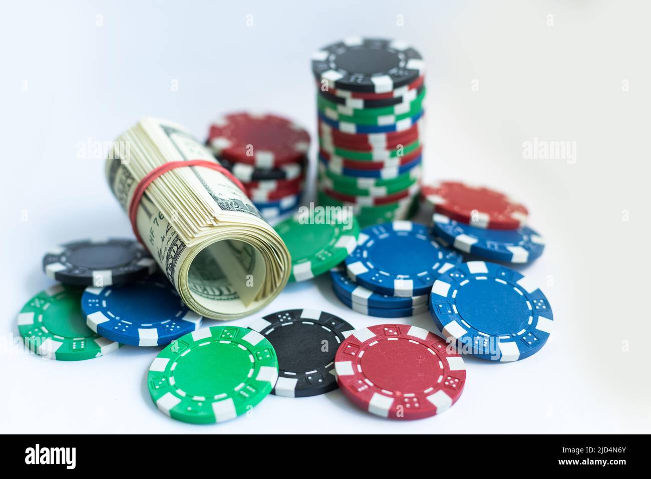 Poker chips, dollars on white background Stock Photo Alamy
