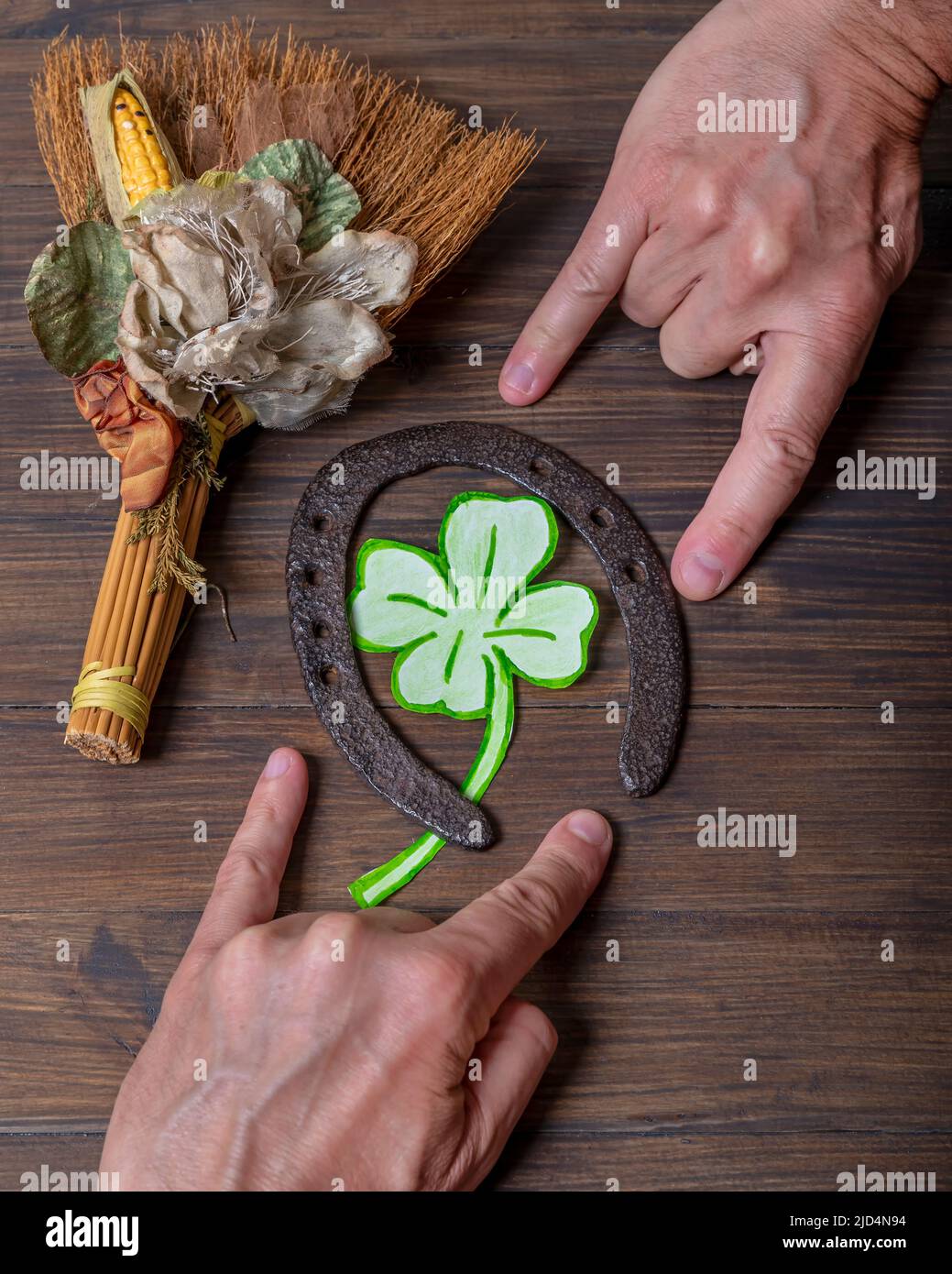 Superstitious gestures and lucky objects in the Italian tradition, such as horns, four-leaf clover and horseshoe Stock Photo