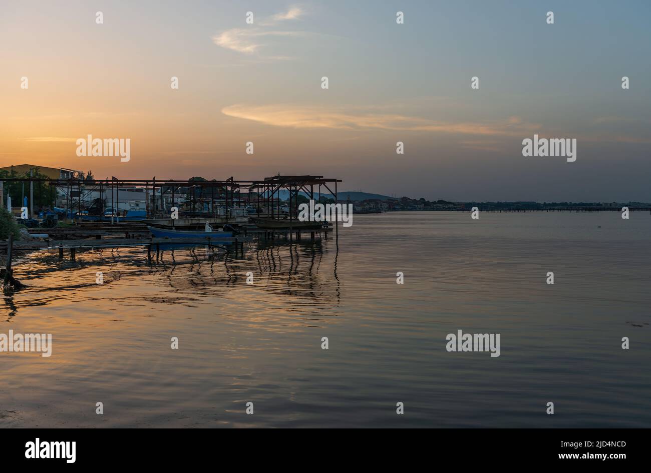 Sunrise in summer, over the oyster farms of the Thau basin, in Occitanie, France Stock Photo