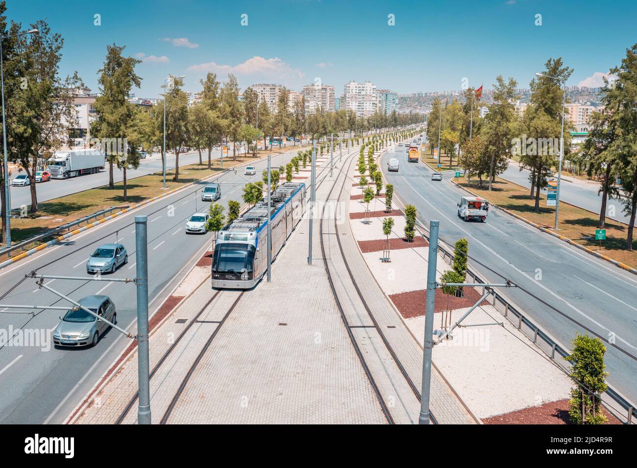 16 May 2022, Antalya, Turkey: Electric eco Antray tram driving parallel ...