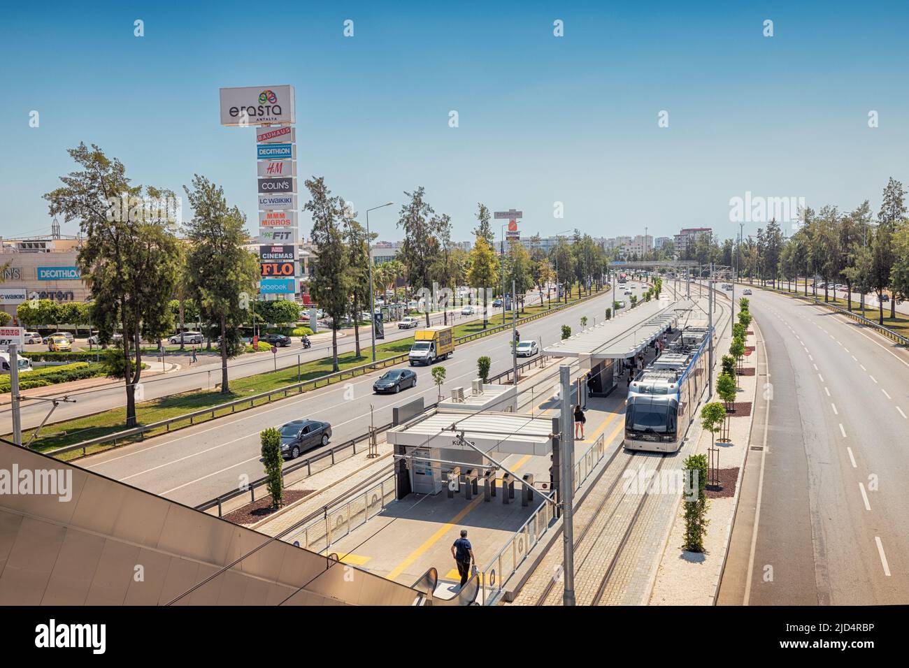 16 May 2022, Antalya, Turkey: Electric eco Antray tram driving parallel ...