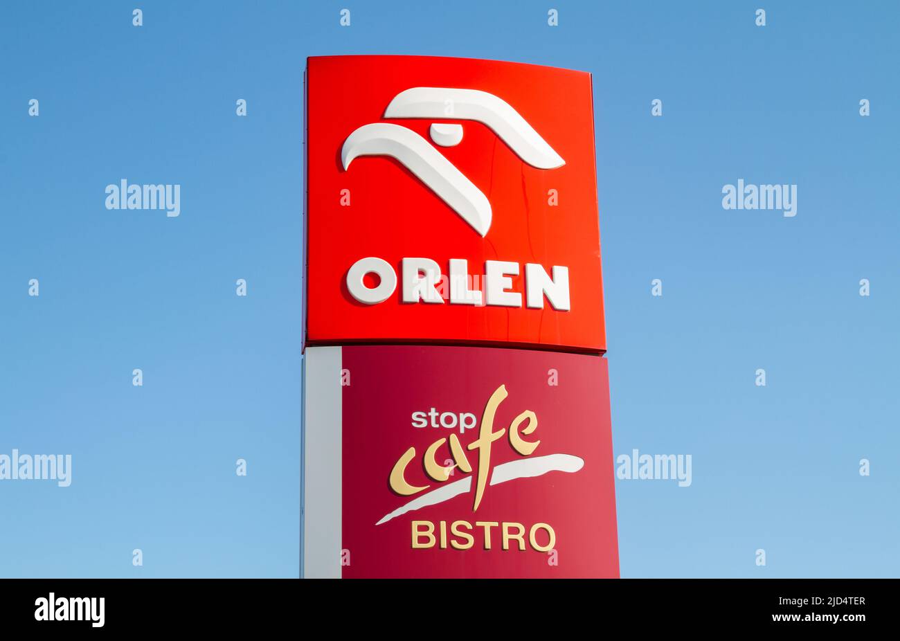 Orlen and Stop Cafe Bistro sign outside a petrol station. Logo at filling gas station forecourt pylon in Krakow, Poland. Stock Photo