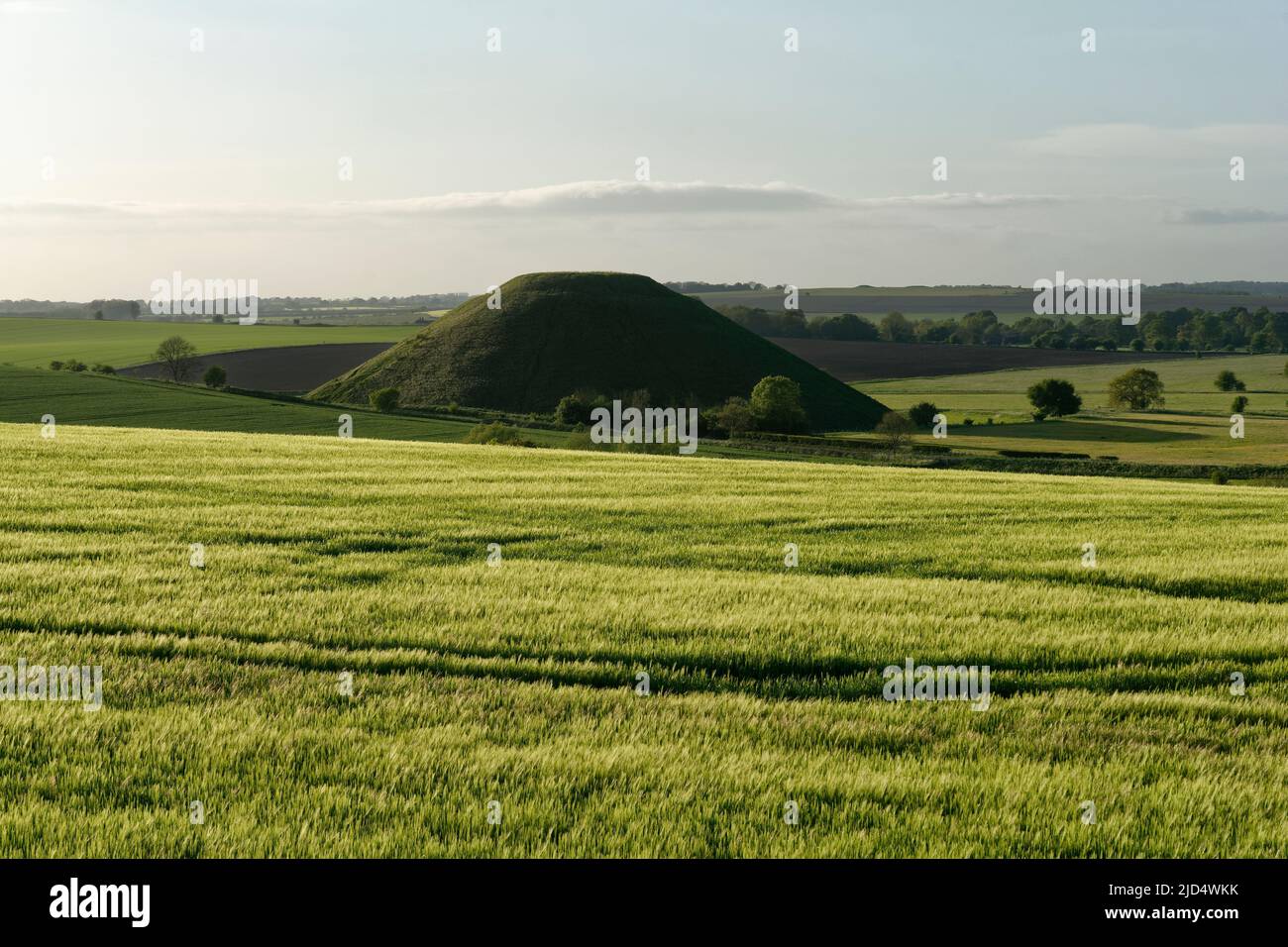 Silbury Hill, Neolithic chalk mound, Avebury, Wiltshire, UK Viewed from West Kennet Long Barrow Stock Photo
