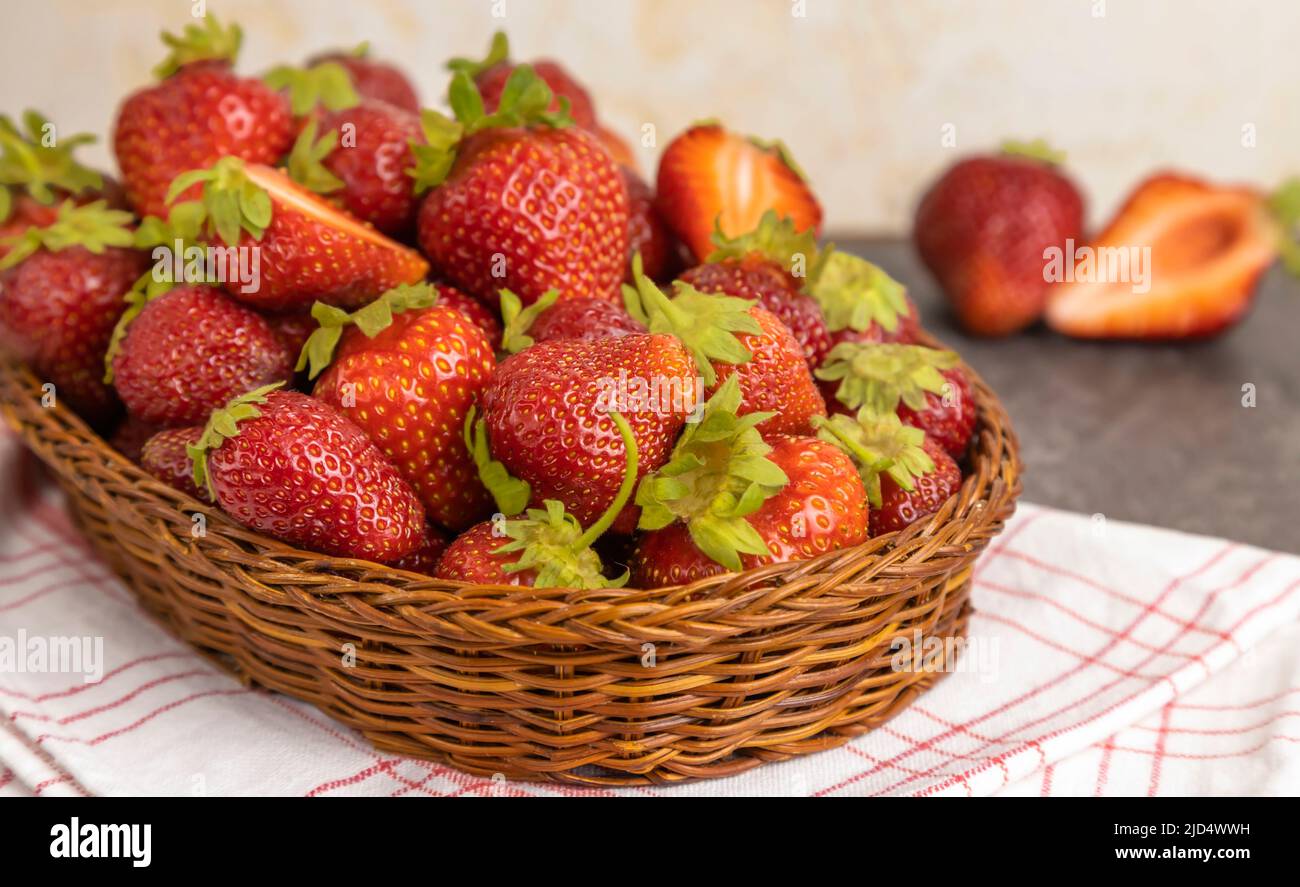 Strawberries in a basket on the table. Close up. Stock Photo