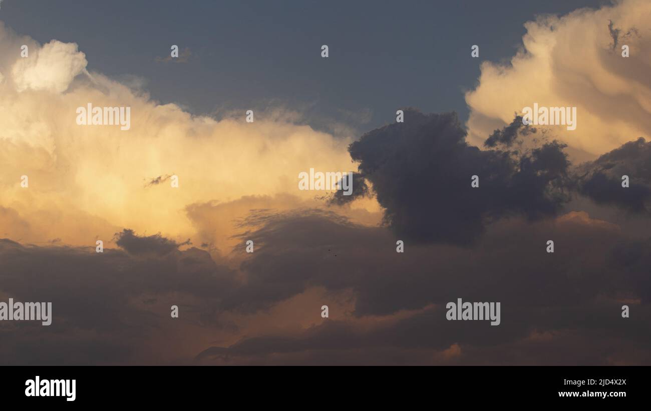 Blue sky with clouds in an evening sky Stock Photo - Alamy