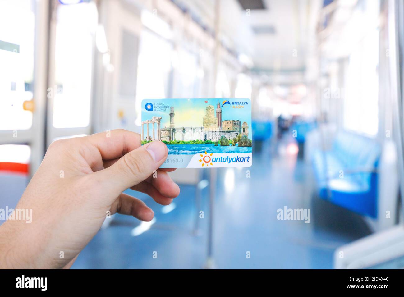 18 May 2022, Antalya, Turkey: Hand of a passenger holding Antalyakart ...