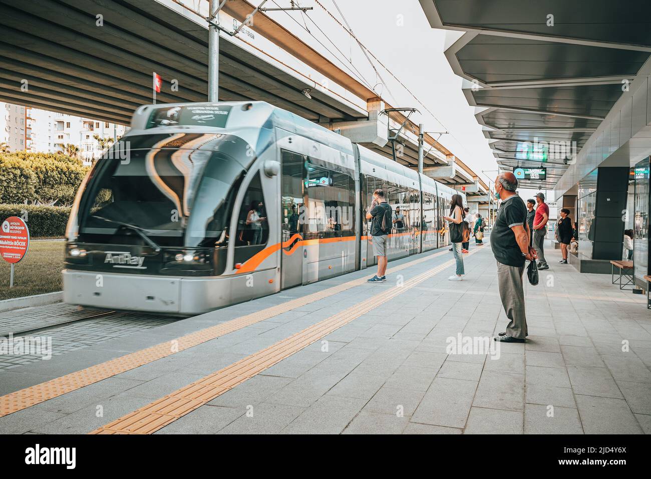 19 May 2022, Antalya, Turkiye: Electric eco tram at the stop boarding ...