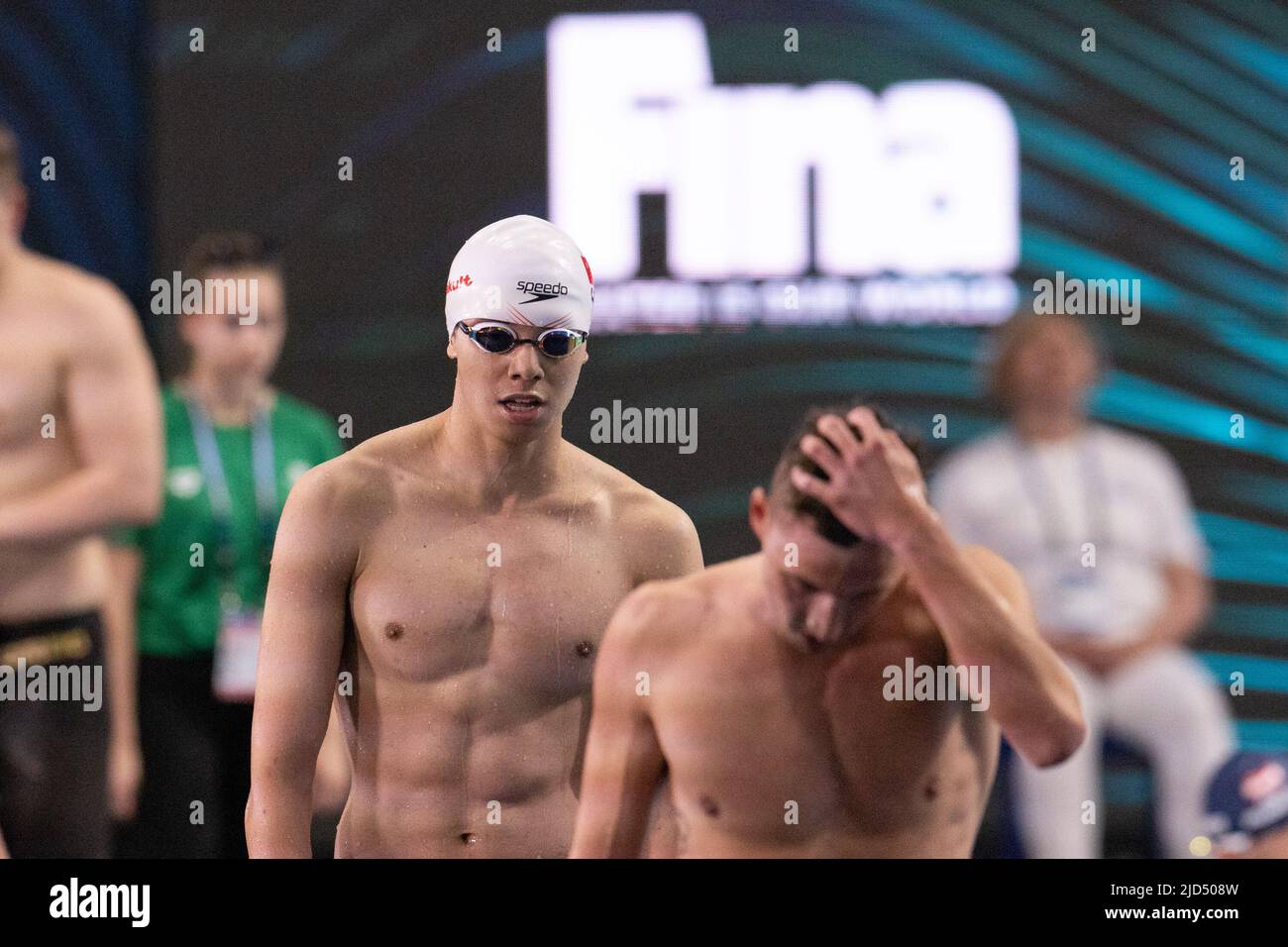 Budapest. 18th June, 2022. Ji Xinjie (L) of China is seen after the men's 400m freestyle heat at the 19th FINA World Championships in Budapest, Hungary on June 18, 2022. Credit: Attila Volgyi/Xinhua/Alamy Live News Stock Photo