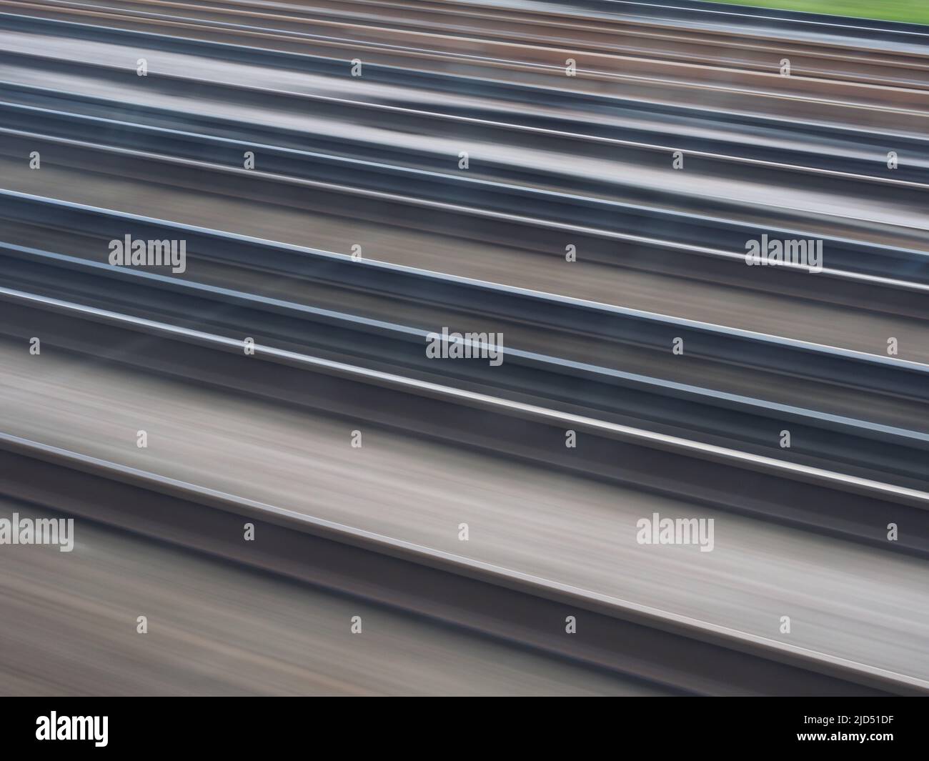 A semiabstract close-up of railway tracks with motion blur Stock Photo