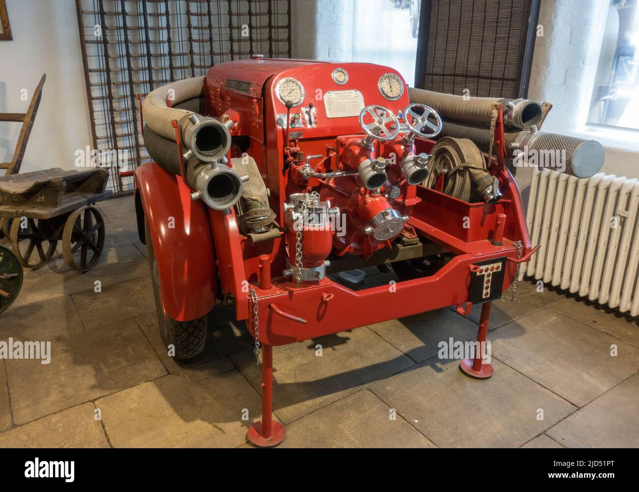 Historic fire pump (Coventry Climax) machine in Salts Mill, a former textile mill, Saltaire, Bradford, W Yorkshire, UK. Stock Photo