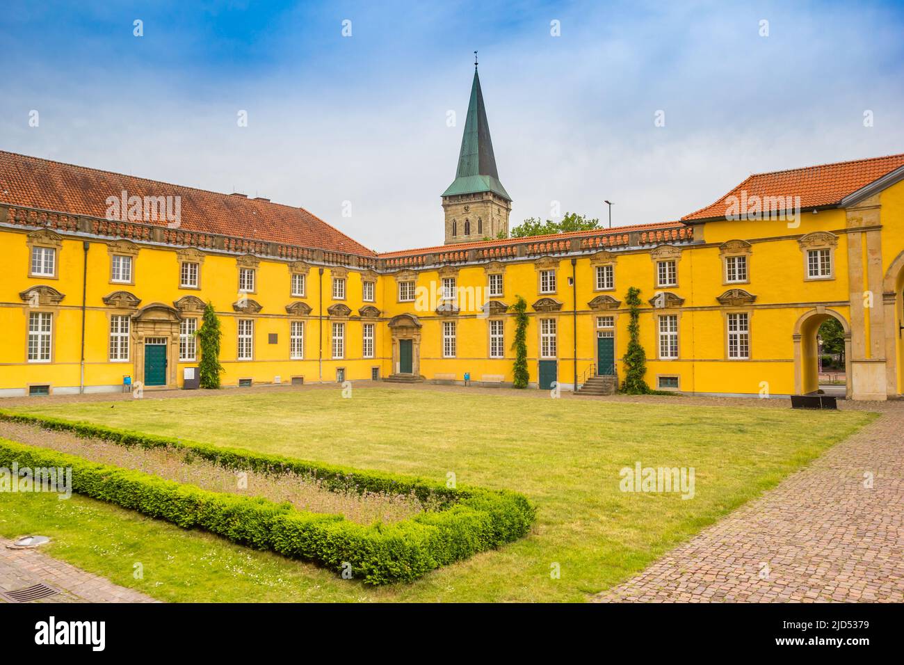 Church tower and courtyard of the castle in Osnabruck, Germany Stock Photo