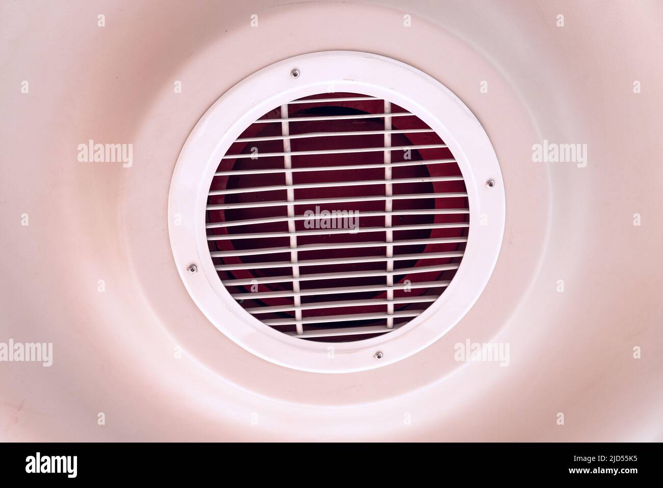 Ventilation grid on a ceiling. Air conditioner and integrated cooling Stock Photo