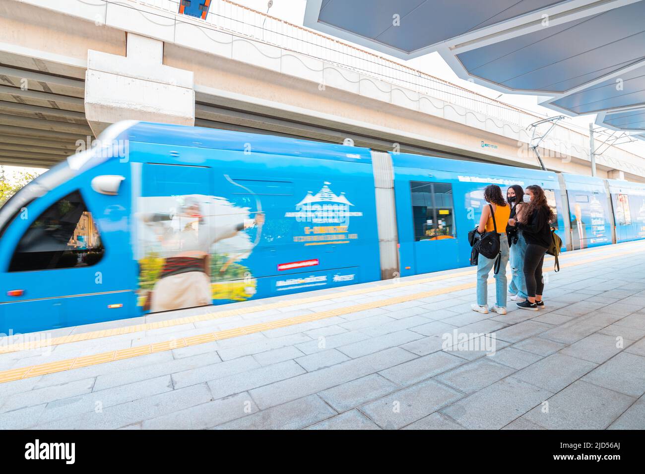 19 May 2022, Antalya, Turkiye: Electric eco tram at the stop boarding ...