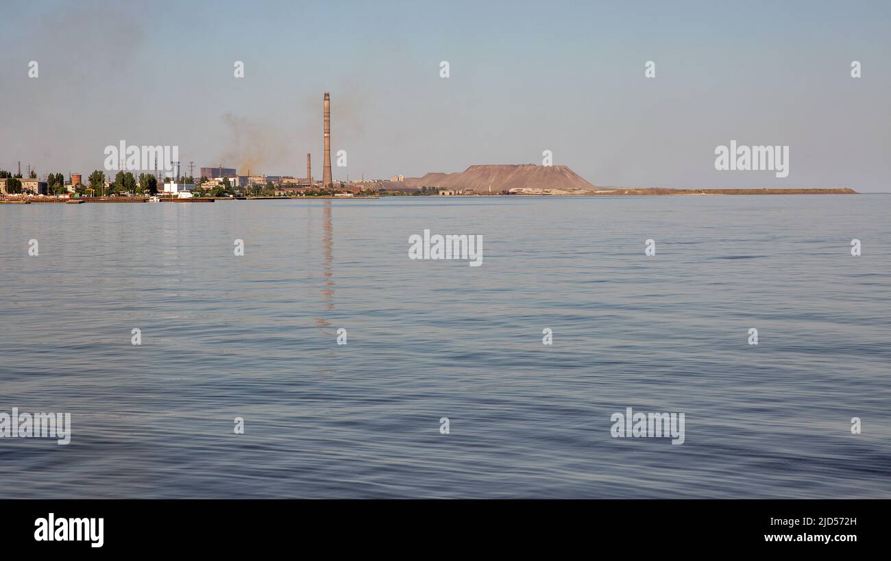 Waterfront in Mariupol, Ukraine, Azovstal steel works in the background. During the 2022 Russian invasion of Ukraine the city was besieged and largely Stock Photo