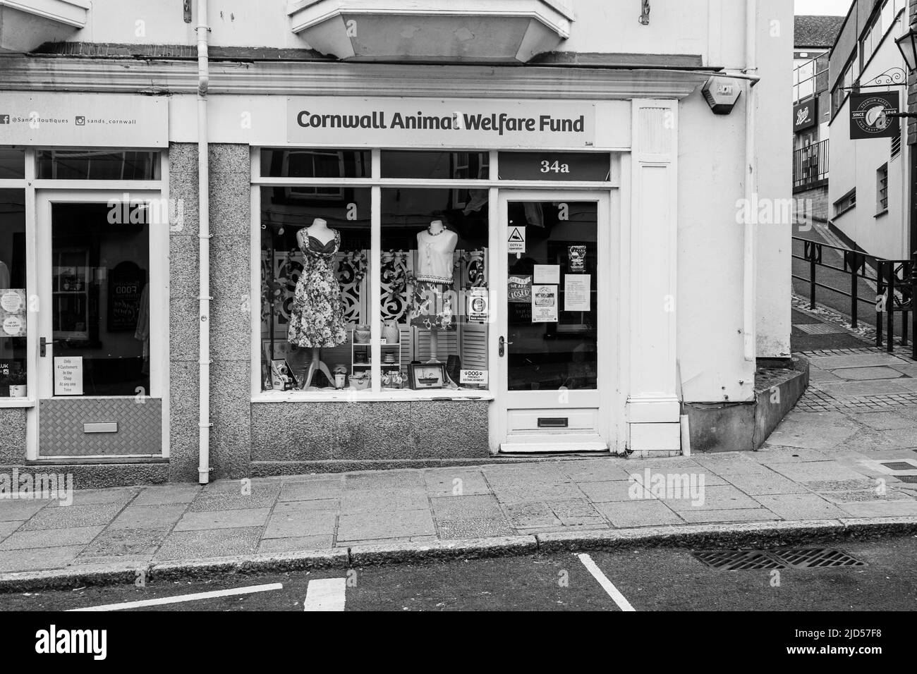 Retail outlets (Cornwall Animal Welfare Fund) in Meneage Street, Helston, Cornwall, England Stock Photo