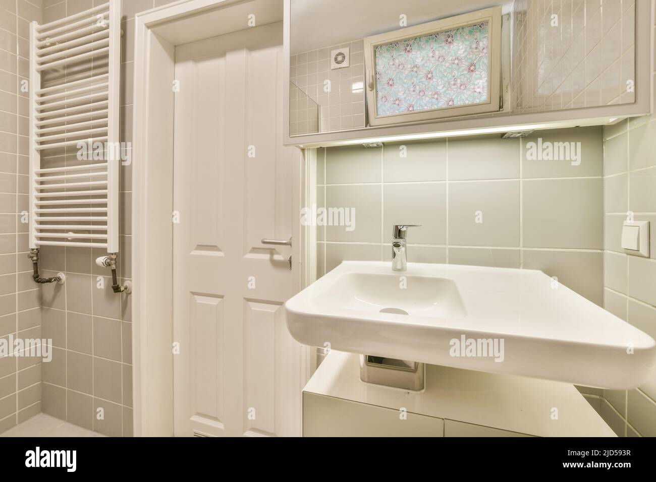 Interior of contemporary bathroom with shower, toilet and sink in