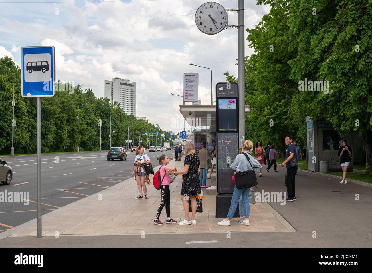 Moscow, Russia - June 14. 2022. People at bus stop on Central Avenue in Zelenograd Stock Photo