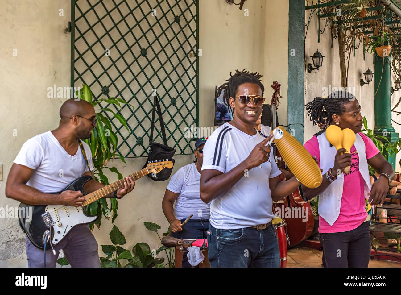 A Cuban Band performs outside a street cafe in Old Havana, Cuba Stock Photo