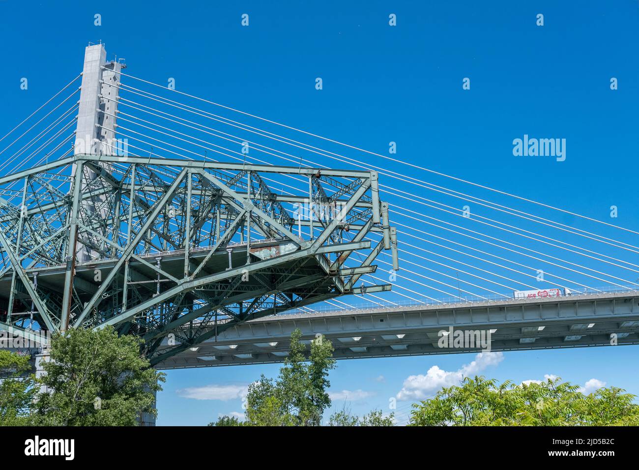 Montreal, Canada - 11 June 2022: New Champlain bridge next to Old Champlain Bridge being demolished Stock Photo