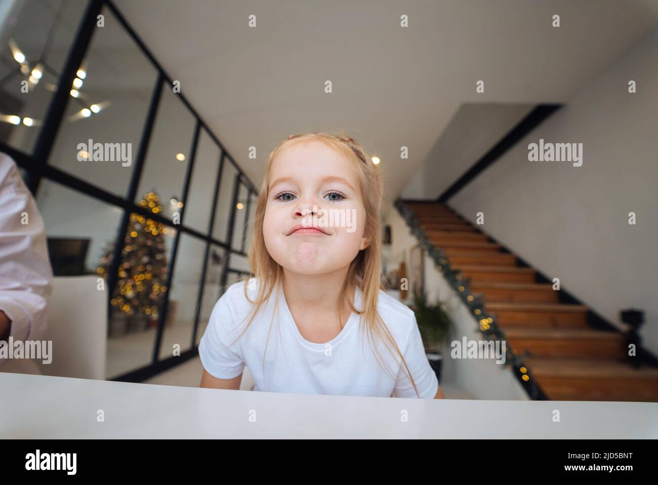 Adorable little girl looking at the camera close-up Stock Photo - Alamy