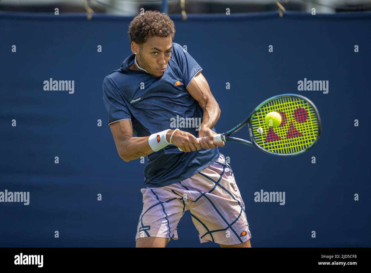 Paul Jubb of Great Britain playing two handed forehand in his game with