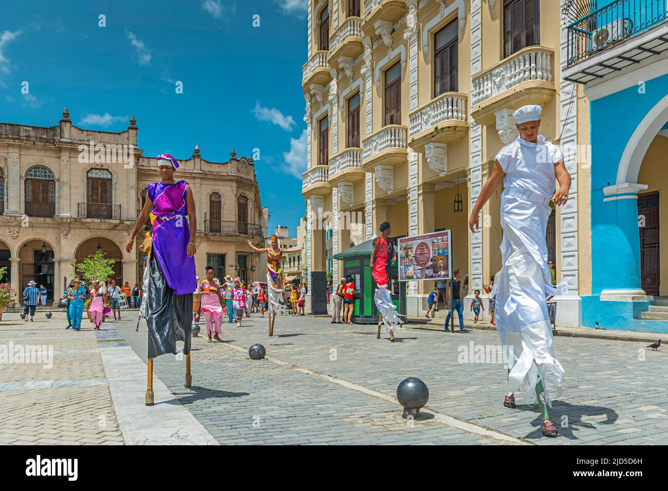 Street artists in their beautiful and colorful costumes at Plaza Vieja in Havana, Cuba Stock Photo
