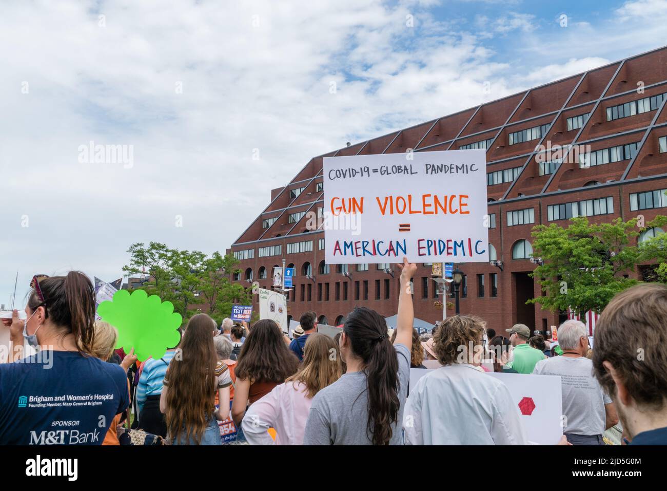 Boston, MA, US-June 11, 2022: March for Our Lives Protest Rally in Boston's Christopher Columbus Park in the North End. Protesters holding anti-gun si Stock Photo