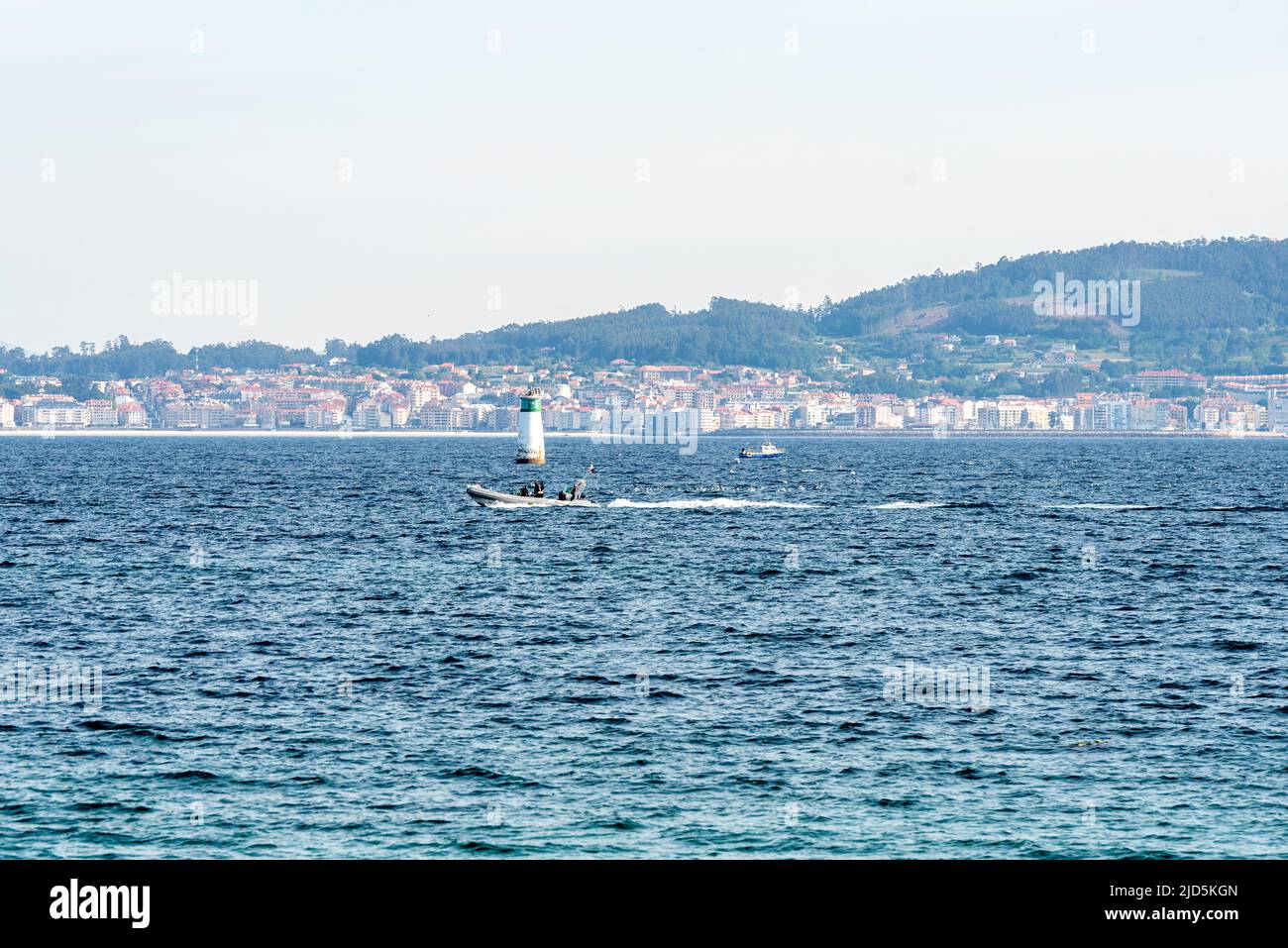 underwater fisherman diving in spanish beach with boat Stock Photo Alamy