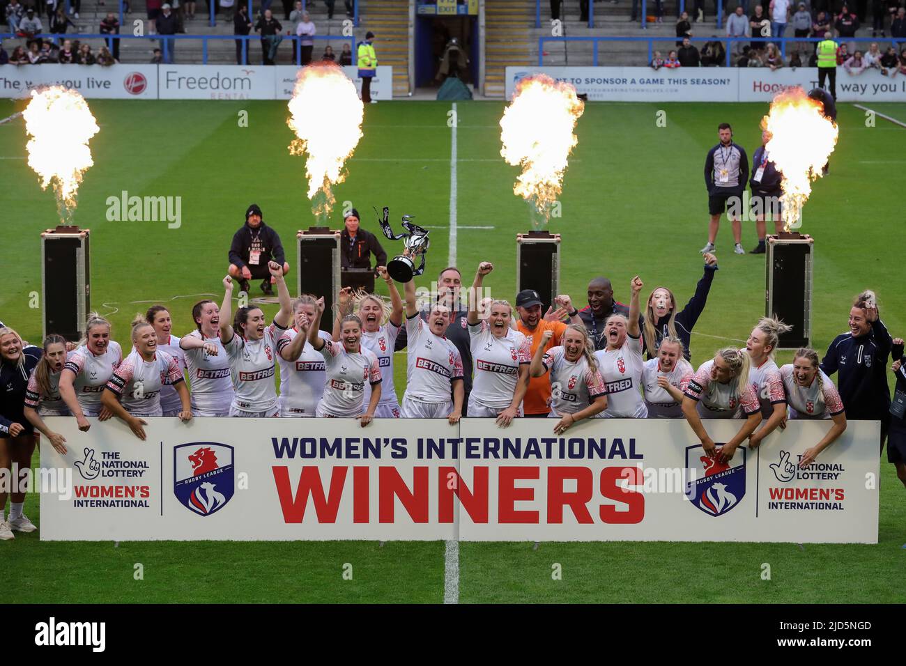 The England women national rugby league team lift the trophy after beating France in the Women’s