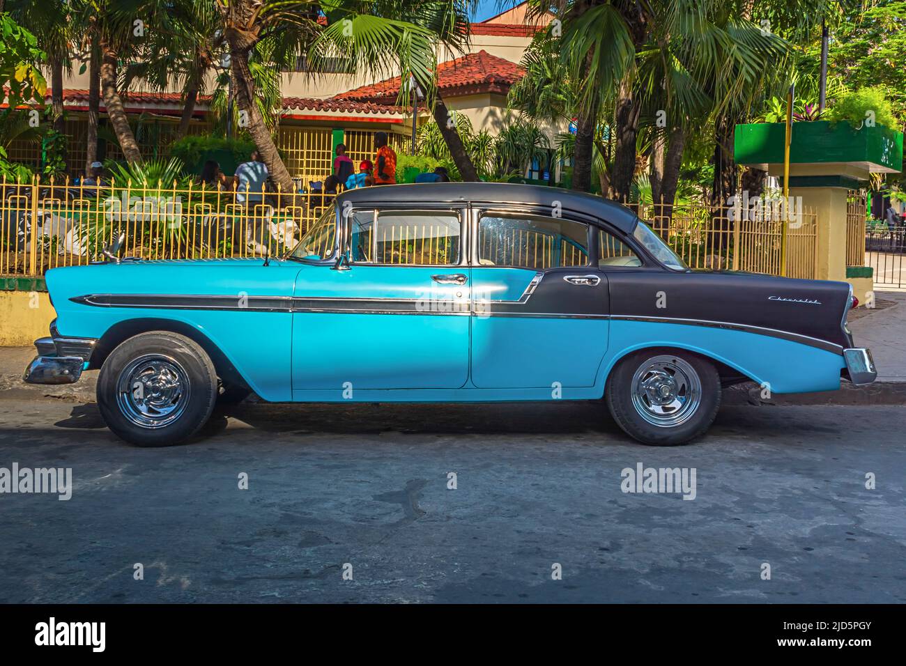 Black and blue vintage car parked in a street in Santiago de Cuba, Cuba