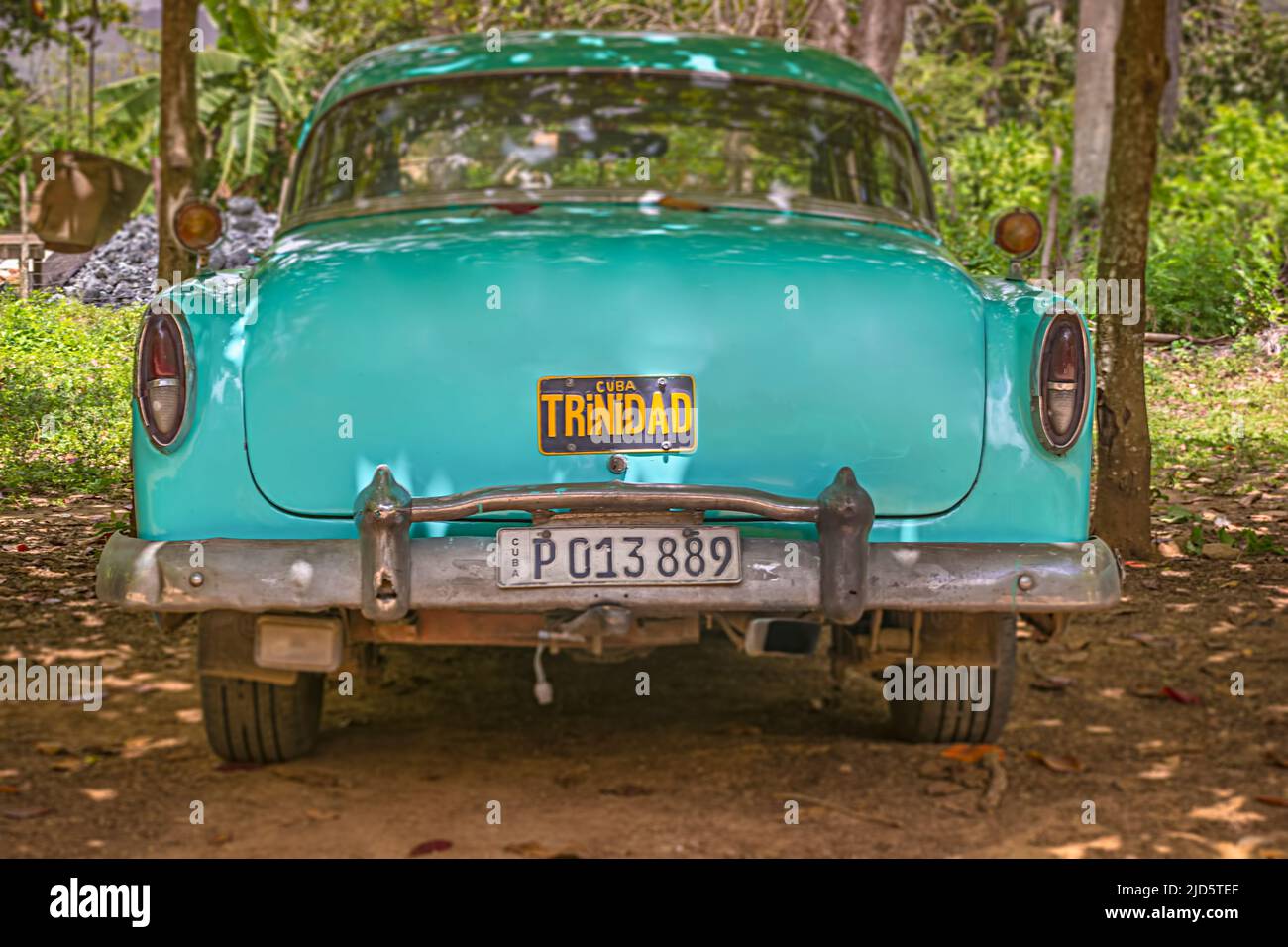 Parked, green-blue Cuban vintage car with Trinidad plate on trunk near Trinidad, Cuba Stock Photo