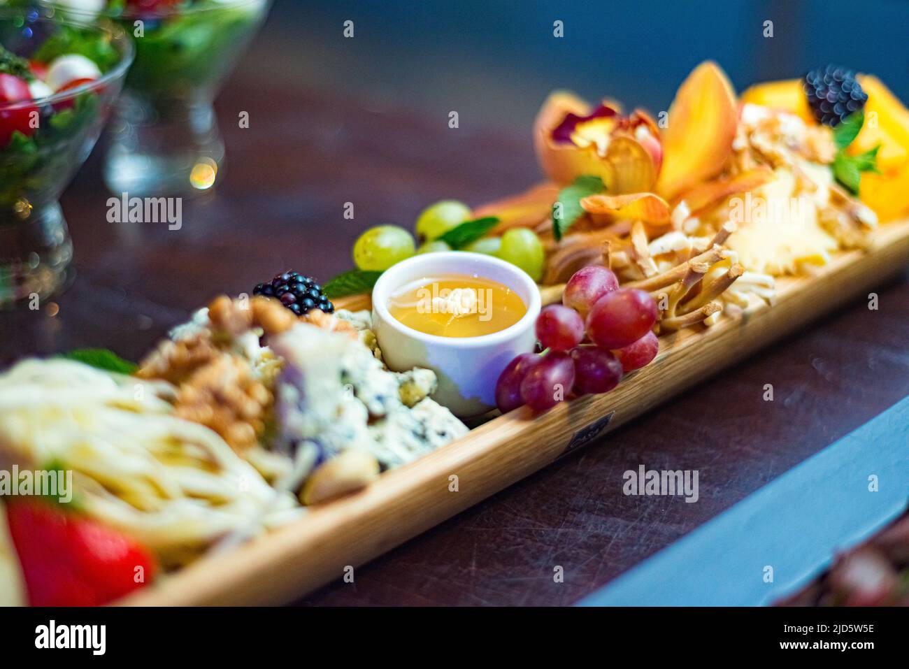 Cheese board with appetizers Cecil, blue mold cheese, cheddar, brie