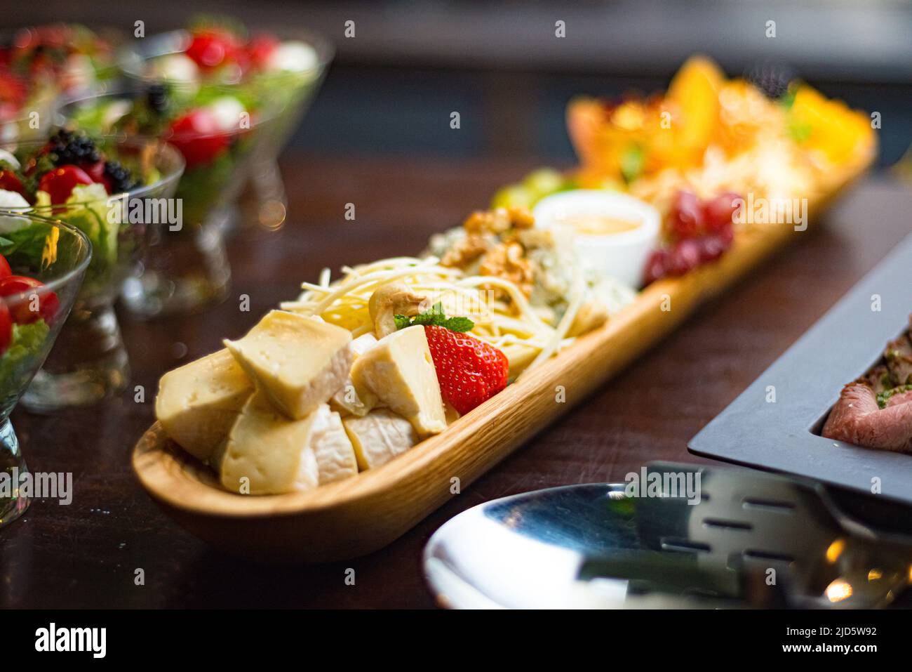 Cheese board with appetizers Cecil, blue mold cheese, cheddar, brie