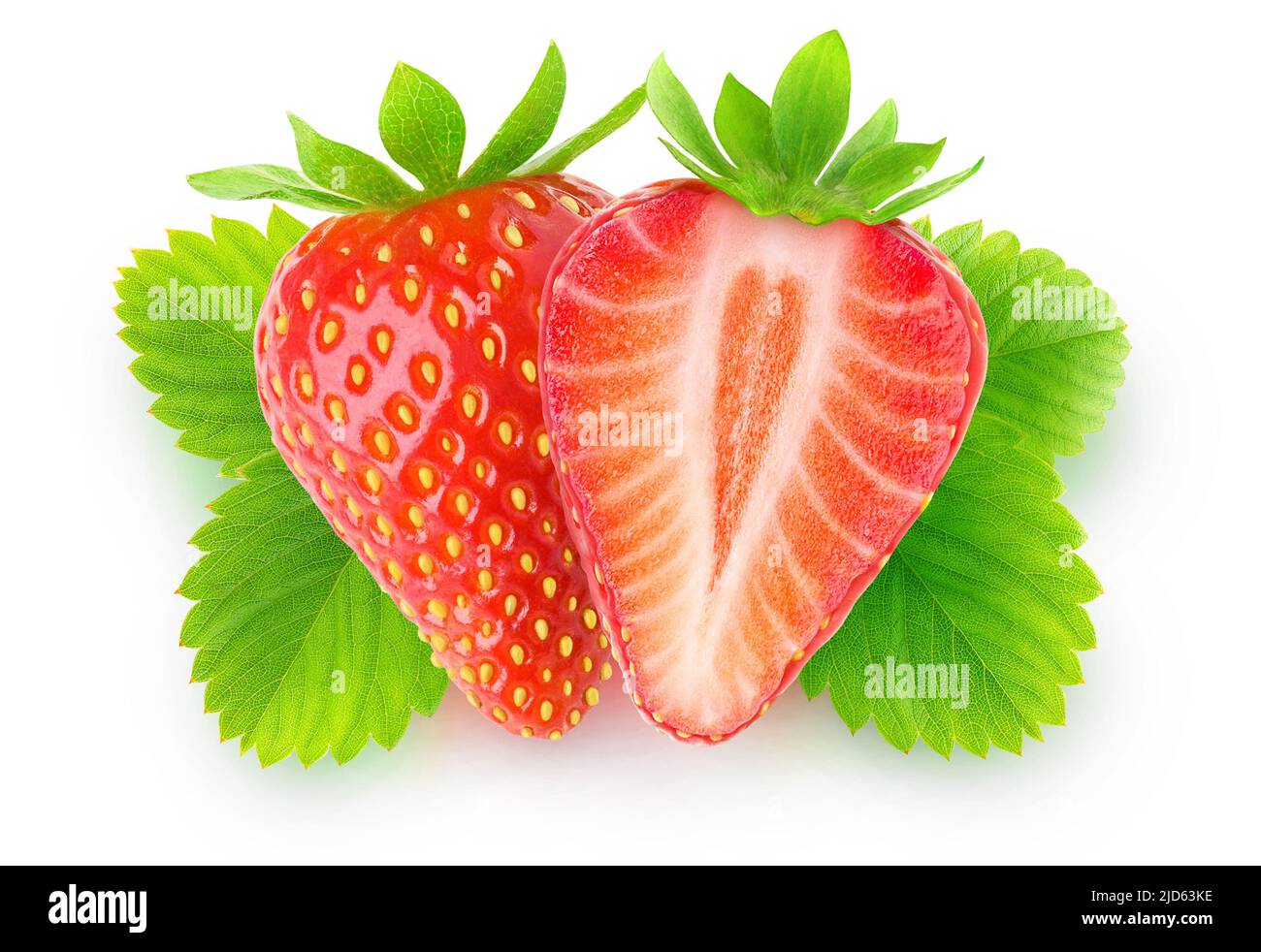 Isolated cut strawberry. One strawberry fruit cut in halves over leaves isolated on white background, top view Stock Photo