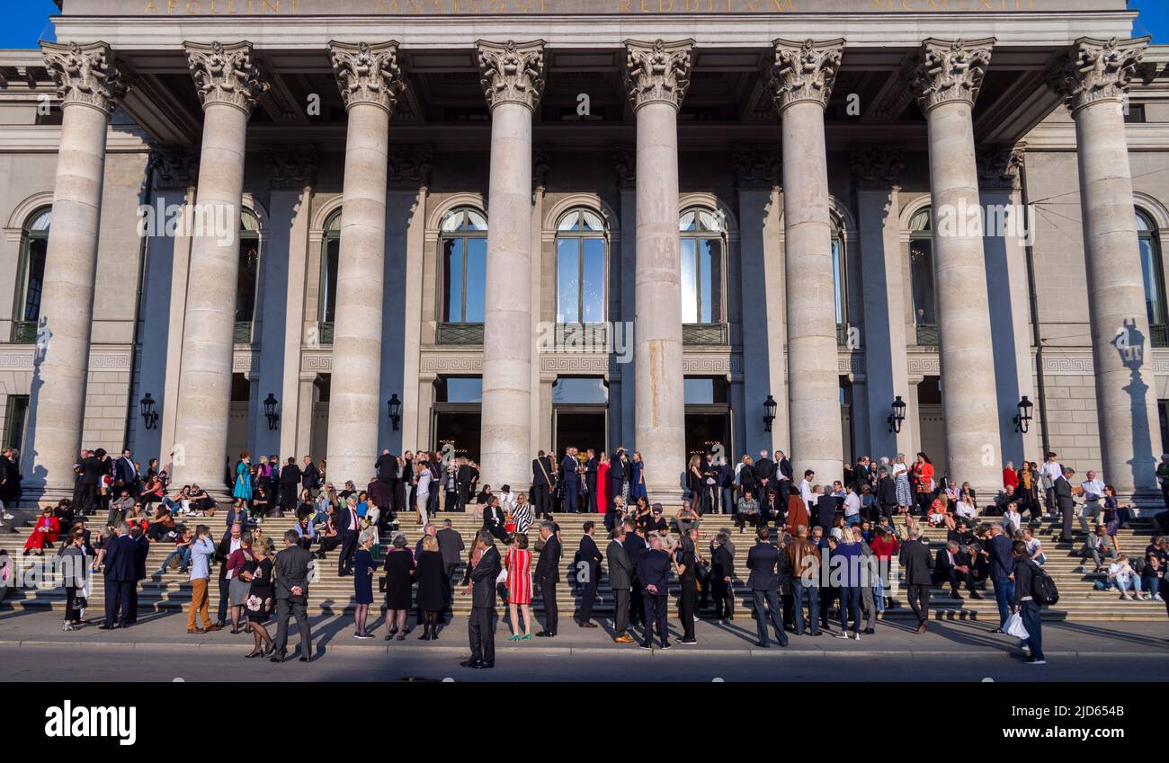 patrons at intermission on the steps of the National Theatre (Nationaltheater), Munich, Bavaria, Germany Stock Photo