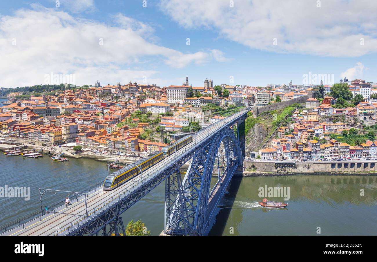 Embankment Ribeira in old town, the Dom Luis I Bridge and Douro river. Cityscape. Porto, Portugal Stock Photo
