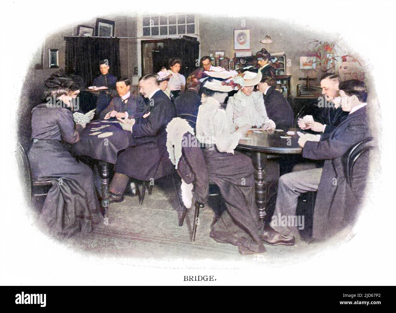 Men and women playing the fashionable game of bridge. Colourised version of : 10029771       Date: 1900 Stock Photo