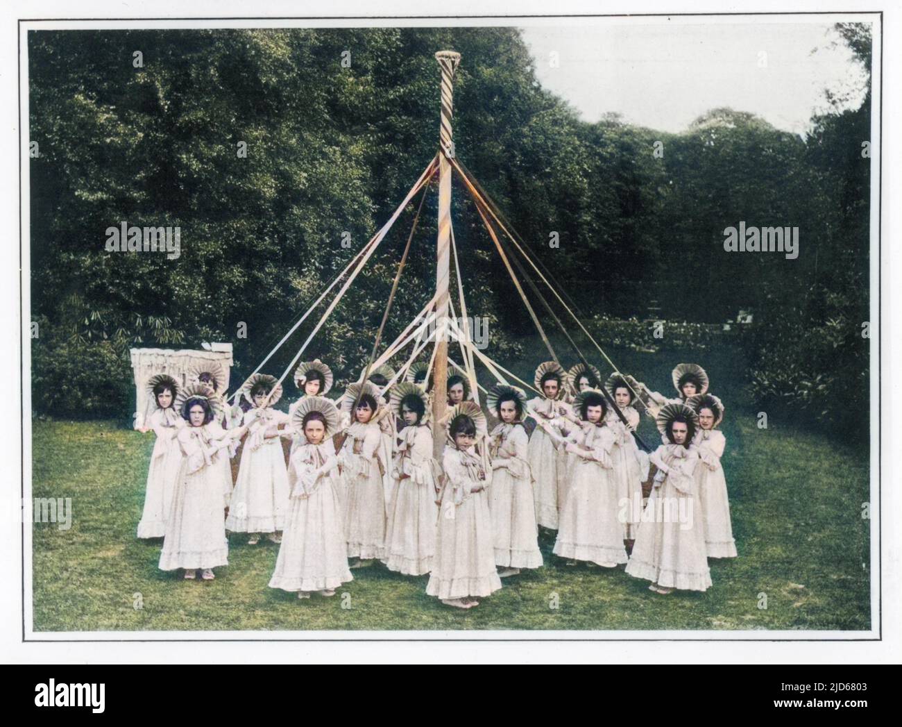 A group of girls and their maypole in Wokingham, Surrey Colourised version of : 10046793       Date: 1904 Stock Photo